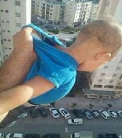 Dangling baby 150 feet high